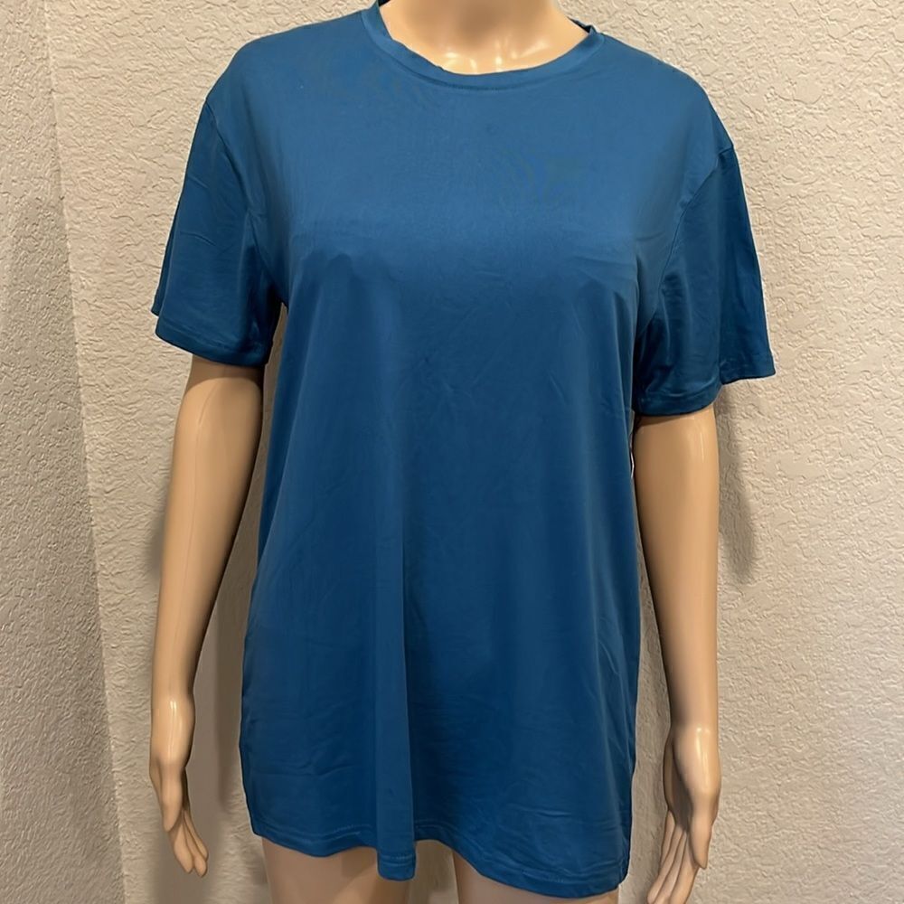 NWT Spyder teal short sleeve top, very soft.